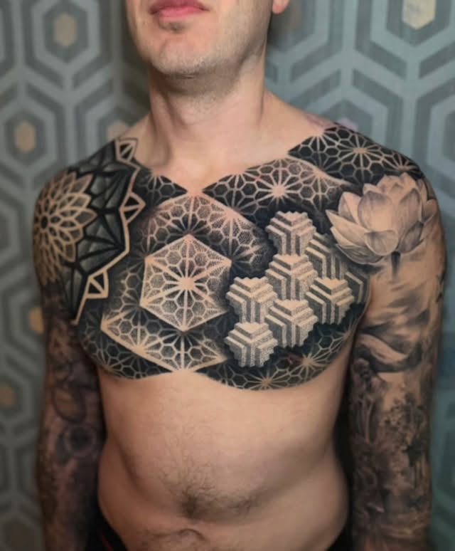 We did some #whiteonblack for the cover up section and a lot of working into the existing previous work that he had to make it all blend nicely. Super happy with how it all came together. I think this is one of the more successful outcomes I’ve ever had when it comes to making my style fit in next to (and into) a completely different style of work. I had a blast every session of this piece - great clients make for great tattoos.#madewithgeometrica @geometricatattooapp @goodpointtattoos by @coryferguson