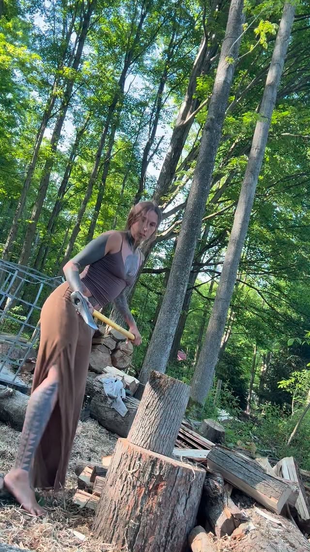 Gotta scratch and sniff all the wood Also I love having clothes that are reaching almost 2 decades old, linen for life #firewood #nature #offgrid #axe #woodworking by @lumberbarbie