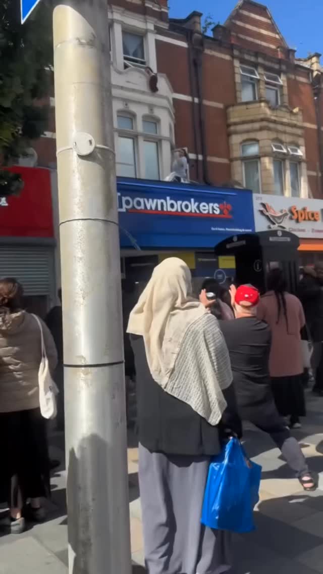 Happened in Ilford today, where a young child was hanging from the window but was saved by an officer and a man